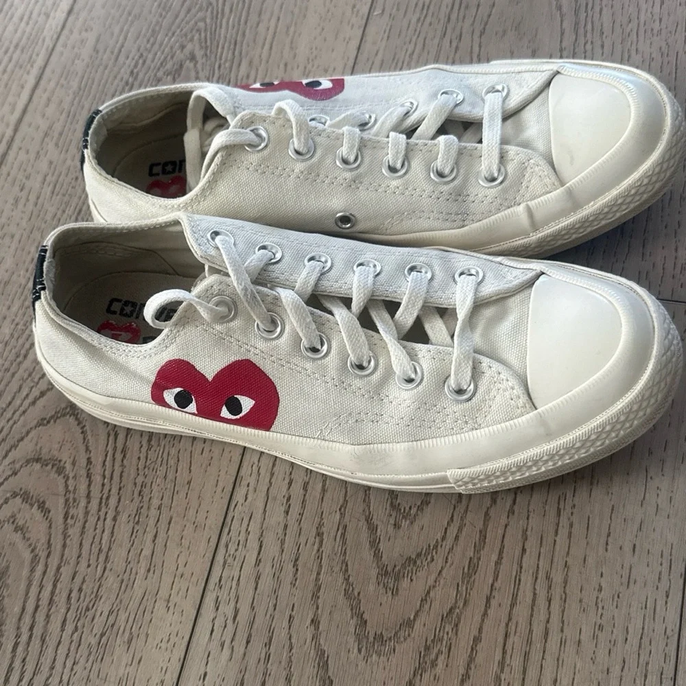 Comme Des Garçons Converse Women’s White Canvas Sneakers with Red Heart Graphic